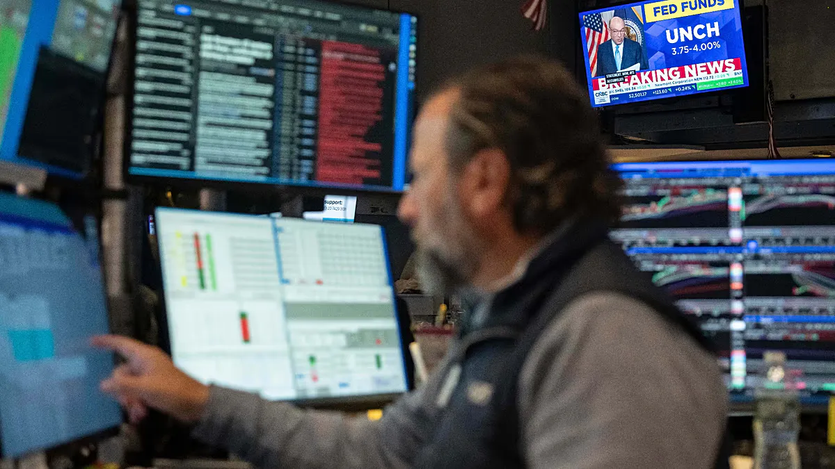 Financial market screens displaying currency rates and share prices
