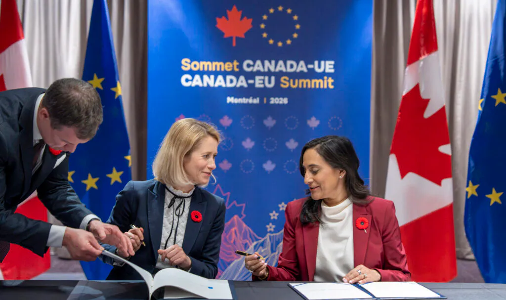 Canadian and EU flags displayed side by side